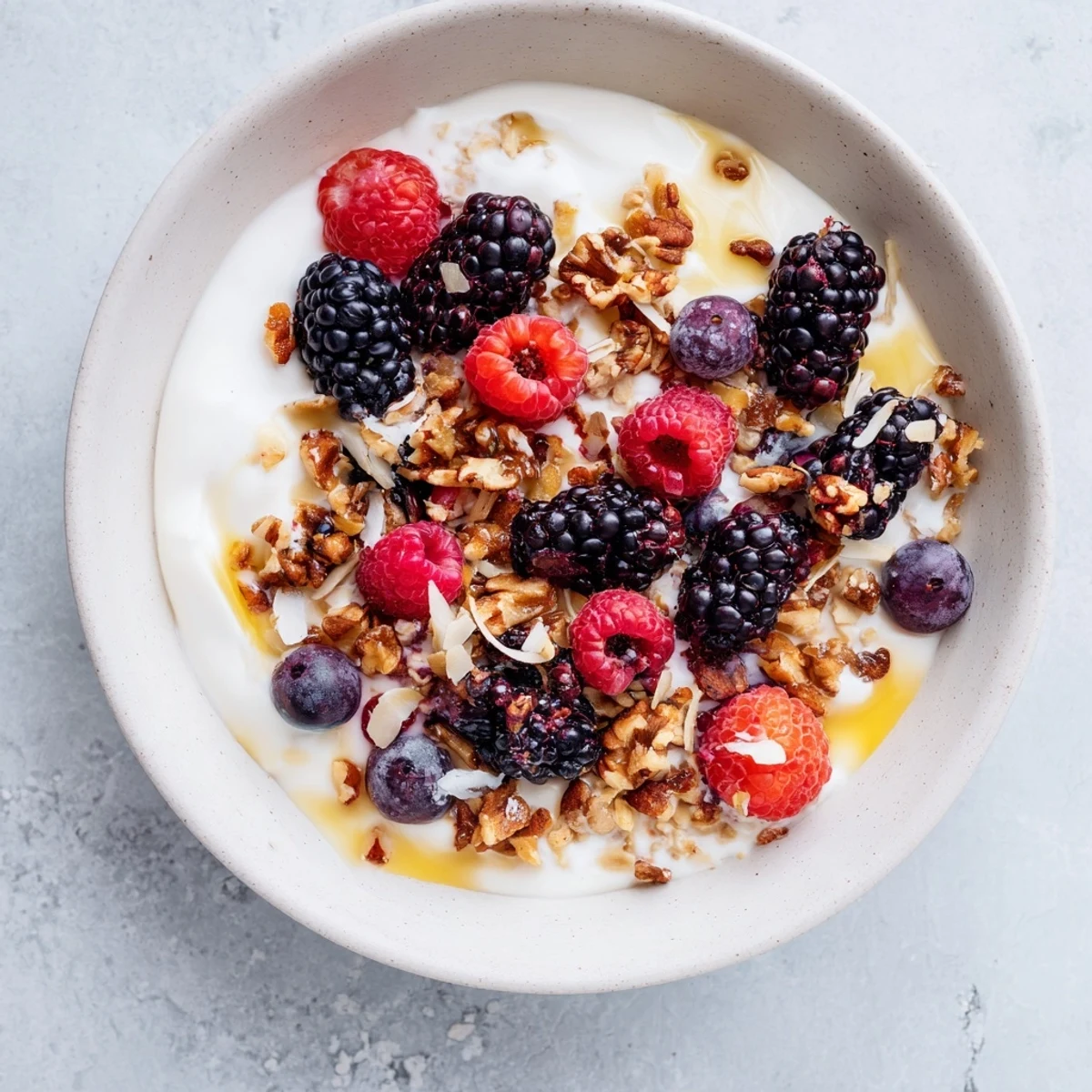 A vibrant bowl of Overnight Oats with Berries and Honey, ready to scoop and enjoy.
