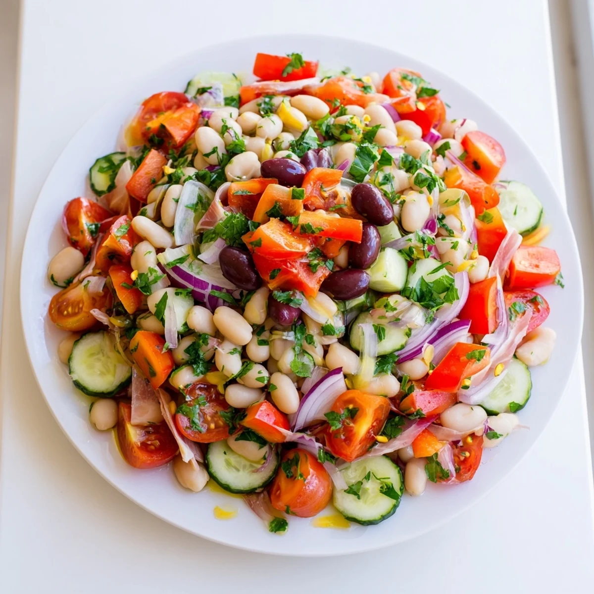 Vibrant dense bean salad with prosciutto, featuring colorful vegetables and delicate prosciutto ribbons.
