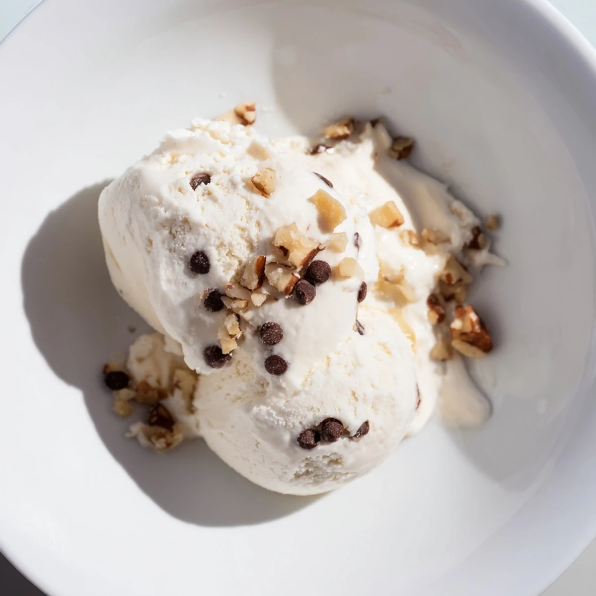 Homemade cottage cheese ice cream with visible berry mix-ins, a cool, refreshing dessert for any day.