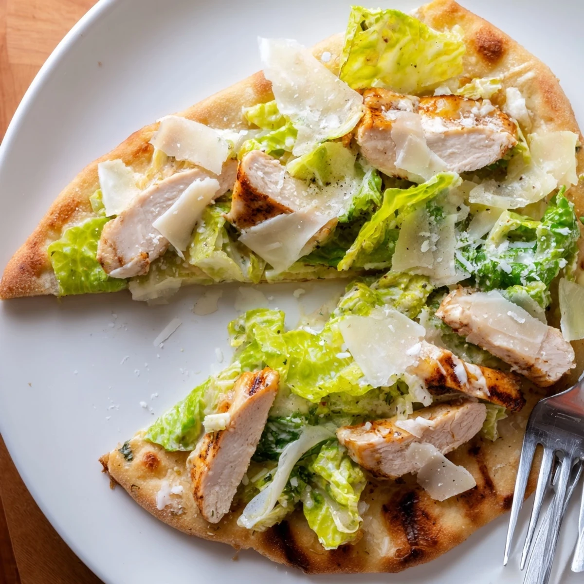 Golden-brown crispy flatbread loaded with juicy grilled chicken, fresh romaine, and tangy Caesar dressing.
