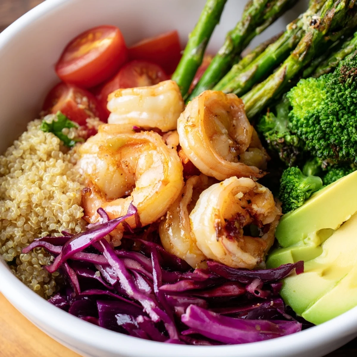 Freshly cooked shrimp and fluffy quinoa shine in this Detox Buddha Bowl, topped with crisp veggies and creamy avocado slices.  