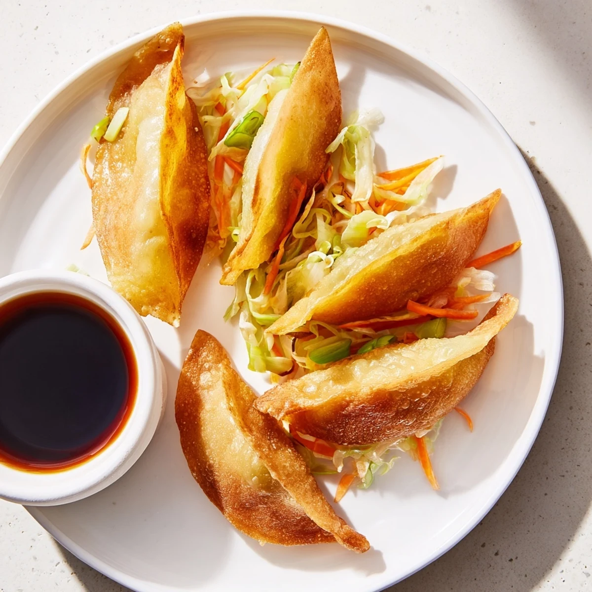 Close-up of a hand dipping a crispy rice paper dumpling into a savory sesame-soy sauce, steam rising from the freshly cooked appetizer.