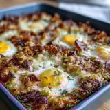 Savory Amish breakfast casserole loaded with crispy hash browns, melted cheese, and fluffy eggs, perfect for feeding a crowd.