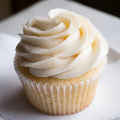 Beautifully frosted vanilla cupcakes, topped with swirls of creamy buttercream for any special occasion.