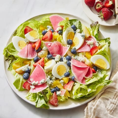 A colorful photo of the Baby Shower Pastel Palette Salad is ready to serve with a light, delicious dressing.