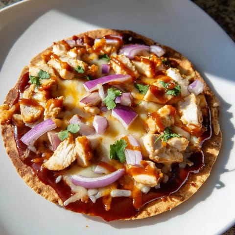 Golden, crispy BBQ Chicken Flatbread with melted cheese, promising a savory, satisfying dinner.