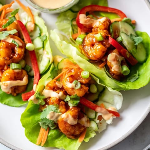 Vibrant shrimp lettuce cups filled with fresh, crunchy ingredients, ready for a delicious, healthy meal.