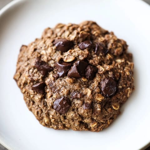 Homemade Chocolate Oatmeal Breakfast Cookies, golden brown and gently cooling after baking, are a healthy treat.
