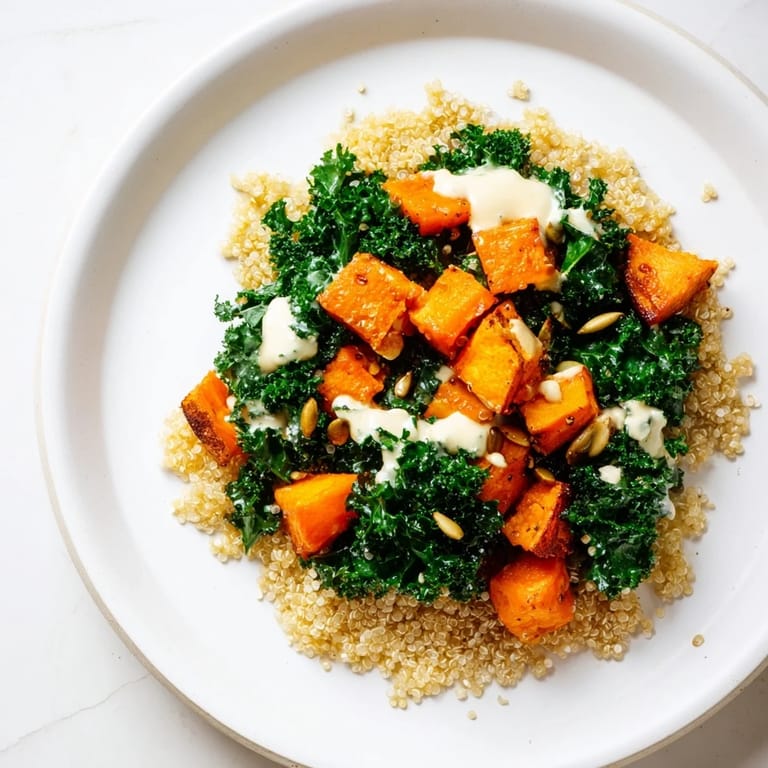 This Light Coastal Bowl features warm roasted sweet potatoes alongside fluffy quinoa and fresh kale.