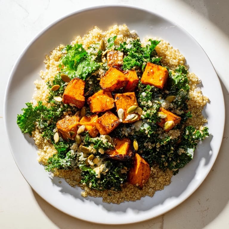 Imagine a Light Coastal Bowl with golden, roasted sweet potatoes and a creamy tahini dressing drizzled on top.