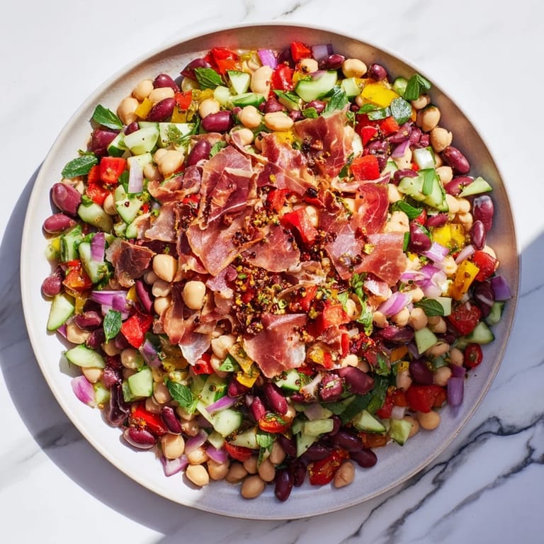 Enjoy this flavorful dense bean salad with prosciutto—a refreshing, gluten-free, Italian-inspired delight.