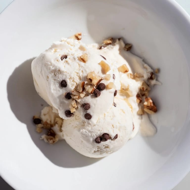 Homemade cottage cheese ice cream with visible berry mix-ins, a cool, refreshing dessert for any day.