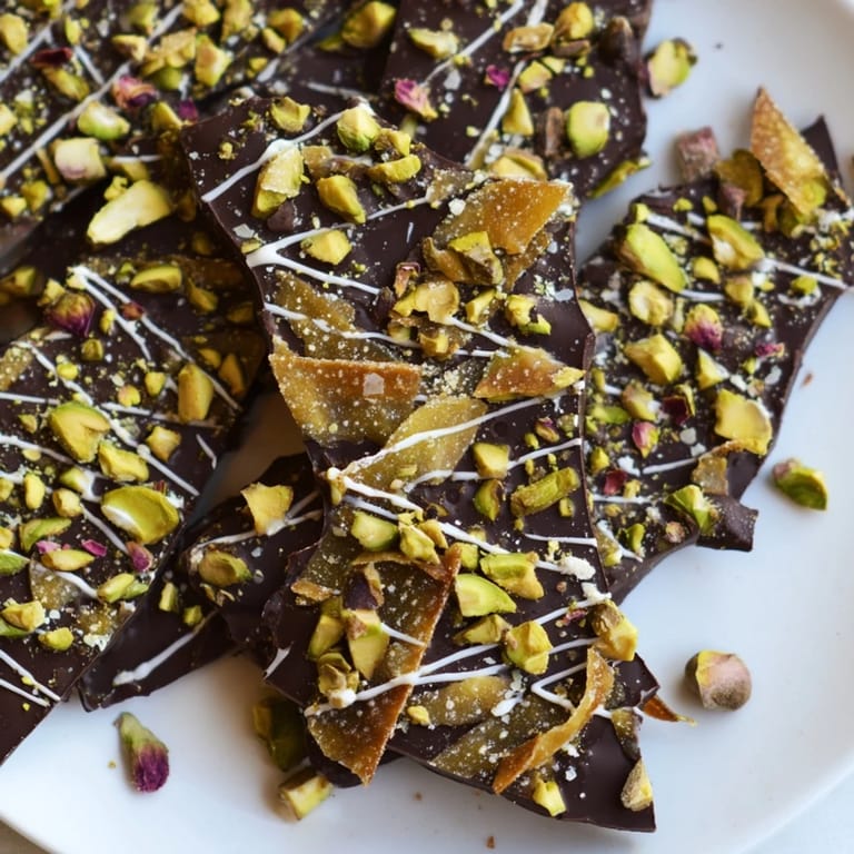A top-down view showcases layers of dark chocolate and flaky phyllo in this Pistachio Dubai Chocolate Bark.