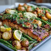 Healthy Easy Sheet Pan Salmon with Green Beans and Potatoes: a colorful one-pan dinner with juicy salmon, golden potatoes, and crisp green beans roasted with lemon and herbs.