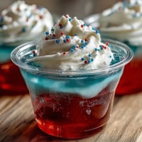 Vibrant 4th of July Firecracker Jello Shots (Alcohol-Free) ready for festive celebrations.